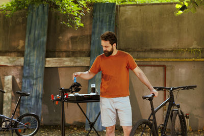 Young man riding bicycle