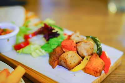 Close-up of fresh salad in plate on table