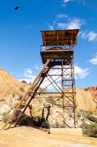 Built structure on land against sky