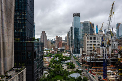 Modern buildings in city against sky