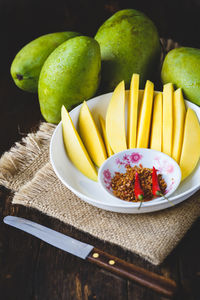 Close-up of fruits in bowl on table
