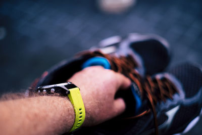 Close-up of hand holding shoes