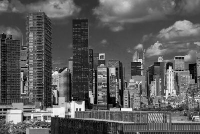 Modern buildings against sky in city