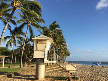 Built structure on beach against sky