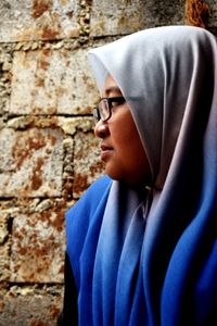 Portrait of teenage boy against wall