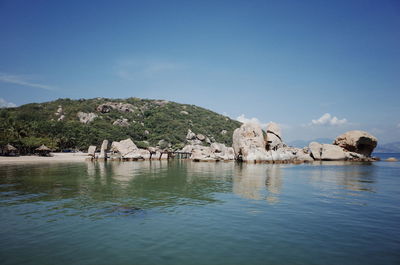 Scenic view of sea against blue sky