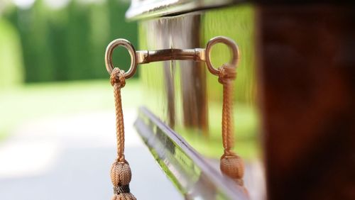 Close-up of rusty chain on field