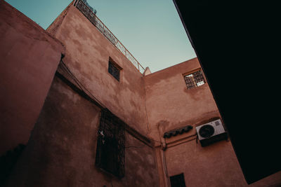 Low angle view of old building against sky