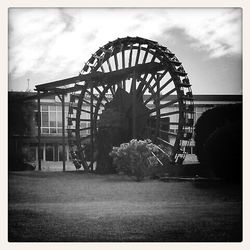 Ferris wheel against cloudy sky