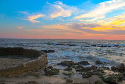 Scenic view of sea against sky at sunset