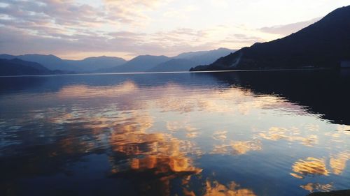 Scenic view of lake against sky during sunset
