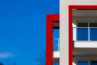 Low angle view of building against clear blue sky
