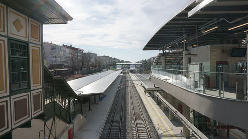 High angle view of railroad tracks amidst buildings in city