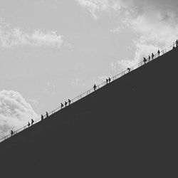 Silhouette of woman against sky