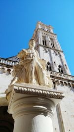 Low angle view of church against clear blue sky