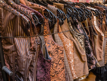 Full frame shot of clothes hanging in rack