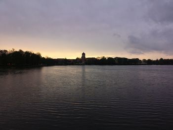 Scenic view of lake against sky during sunset