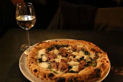 Close-up of pizza served on table