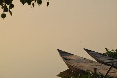 Scenic view of lake against sky at sunset