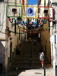 Rear view of woman walking in corridor