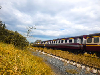 Train on railroad track against sky