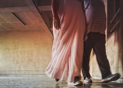 Low section of people standing on floor