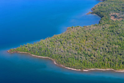 High angle view of bay against clear blue sky