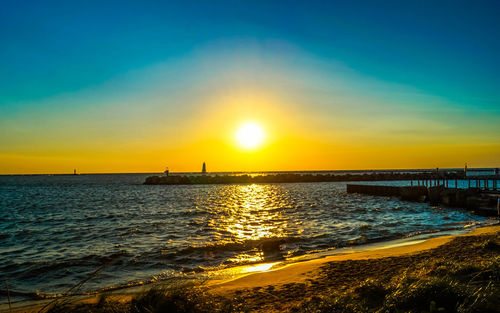 Scenic view of sea against sky during sunset