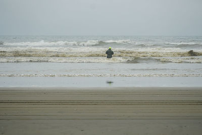 Scenic view of beach against clear sky