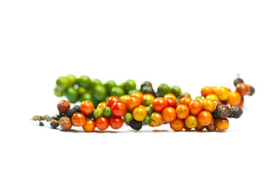 Close-up of fruits against white background