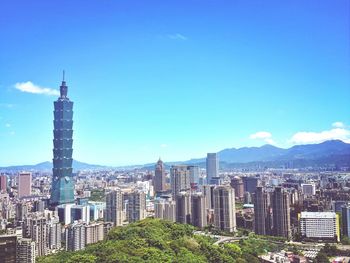 Taipei 101 with cityscape against blue sky