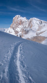 Scenic view of snowcapped mountains against sky