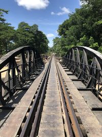 View of railroad tracks against cloudy sky