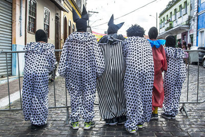 Rear view of group people wearing carnival costume