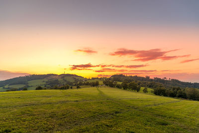 Scenic view of landscape against sky during sunset