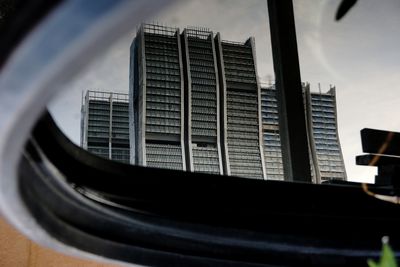 Low angle view of office building against sky