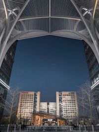 Low angle view of modern buildings against clear sky