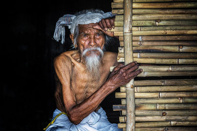 Portrait of man sitting outdoors