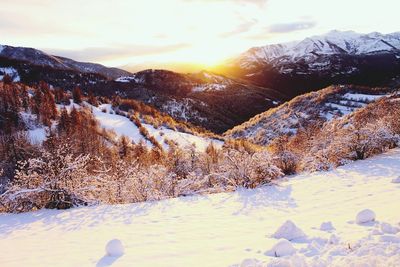 Scenic view of snow covered mountains