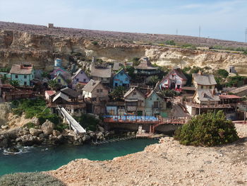 Houses in town against sky