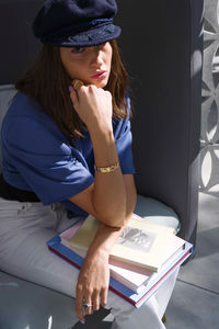 Young woman in the library with books