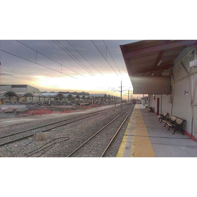 railroad track, transportation, the way forward, rail transportation, transfer print, built structure, diminishing perspective, vanishing point, architecture, railroad station platform, public transportation, railroad station, auto post production filter, sky, building exterior, sunlight, empty, clear sky, day, no people