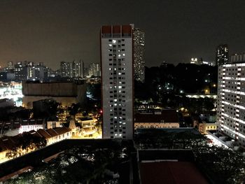 High angle view of illuminated buildings in city at night