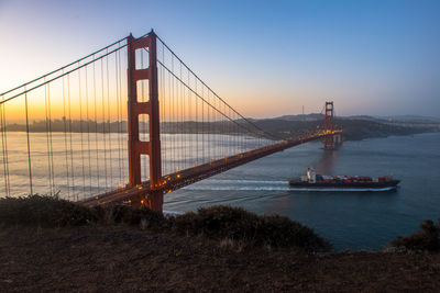 View of suspension bridge at sunset