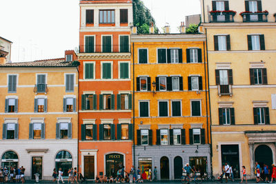 People walking by residential buildings