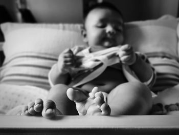 Boy relaxing on bed at home