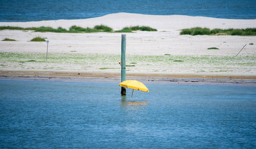 Yellow umbrella on beach