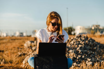 Young woman using mobile phone