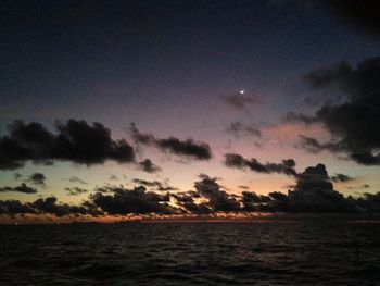 Scenic view of sea against sky at sunset