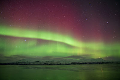 Scenic view of sea against sky at night